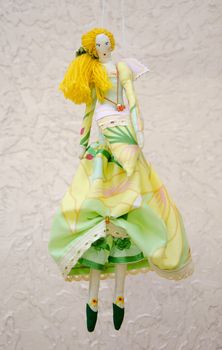 Handmade doll in a ball gown with wings and a bag in the shape of heart