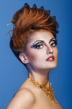 Close-up portrait of a young and attractive girl with hairstyle and jewelry