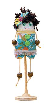 The handmade doll soft toy isolated funny girl on the stand