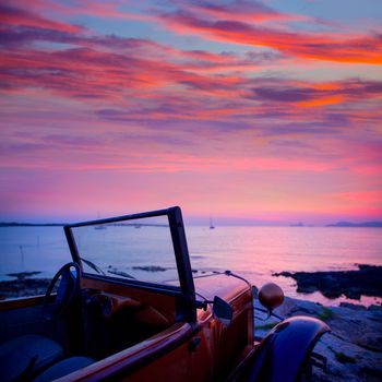 Ibiza sunset view from vintage car at formentera Island in Balearic Islands