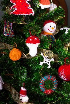 Knitted christmas  toys on the christmas tree