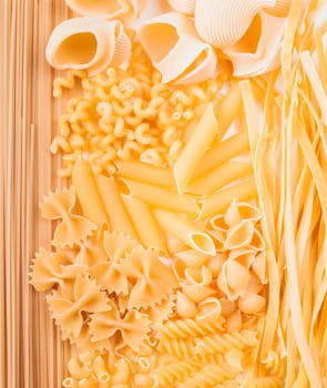Various pasta  types as a background on the table