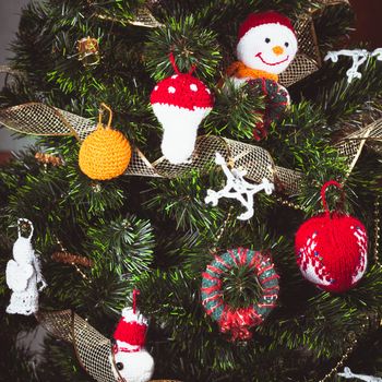 Knitted christmas  toys on the christmas tree