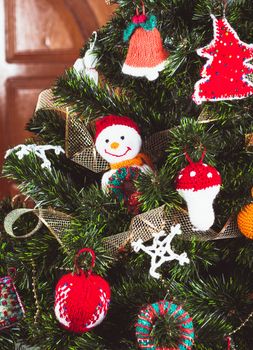 Knitted christmas  toys on the christmas tree