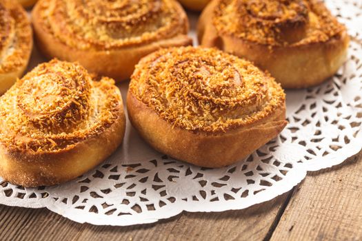 Coconut rolled buns on the wooden table