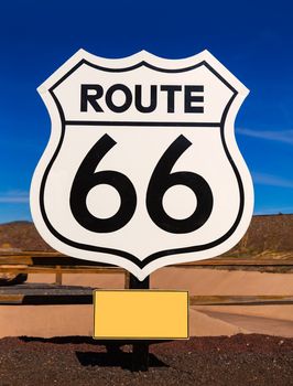 Route 66 road sign in Arizona under blue sky USA