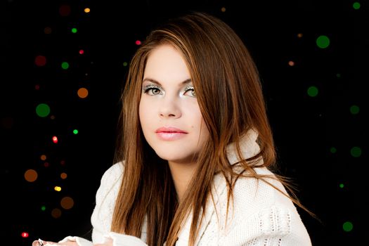 Friendly smiling young woman portrait studio shot