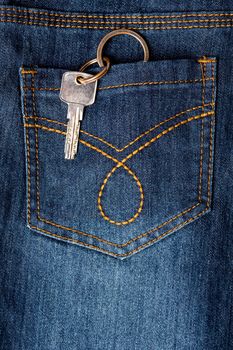 Closeup of a jeans back pocket with key hanging out