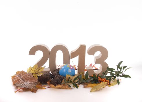 Year in numbers with autumn leaves and other product for New Year