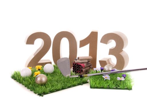 Golfstick and green symbolizes golfsport in the New year