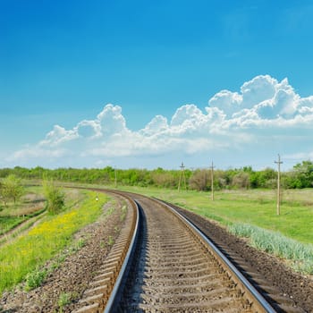 railroad to horizon in green landscape