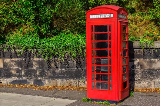 Typical British telephone booth in the park