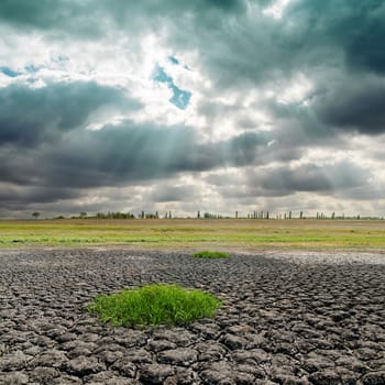 dramatic sky and cracked earth