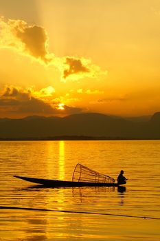 Sunset at Inle Lake with silhouette of fisherman, Myanmar, Asia
