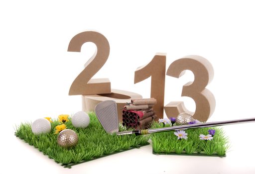 Golfstick and green symbolizes golfsport in the New year