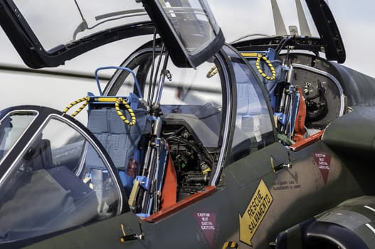 Detailed view of a fighter jet airplane cockpit.