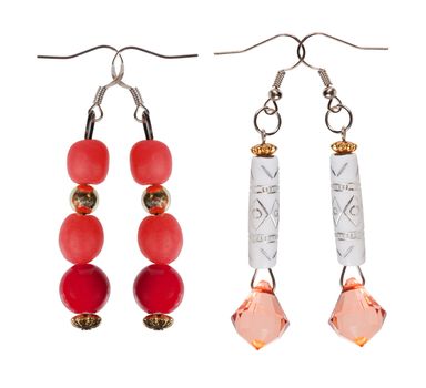 Earrings- pendants with sequins and red beads isolated on a white background. Collage.