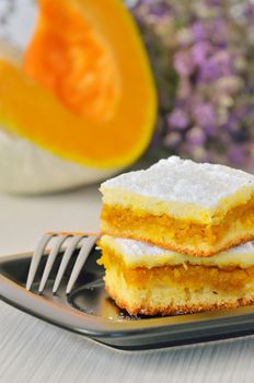 pumpkin pie on black dish