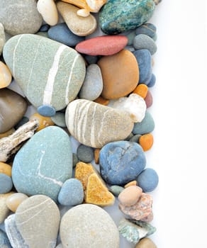 colored stones on white background on white background 