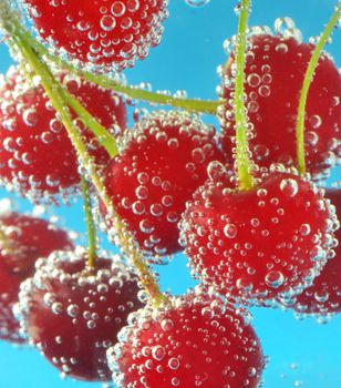 cherries and bubbles in mineral water