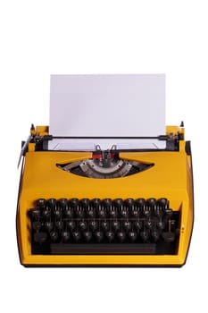 yellow typewriter with white paper