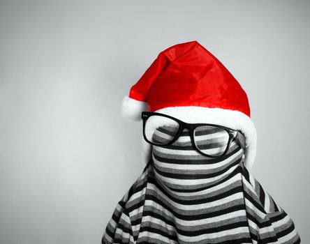 strange Santa Claus in a striped dress and glasses