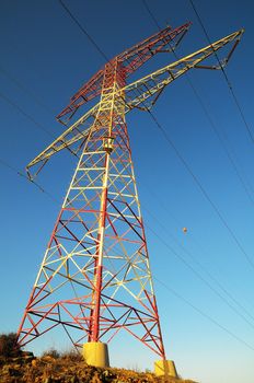 Electric Power Line Pylon over a colored Sunset