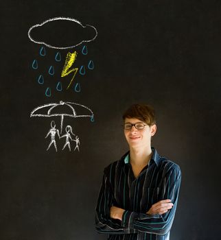 Man  or Teacher thinking about protecting family from natural disaster on blackboard background