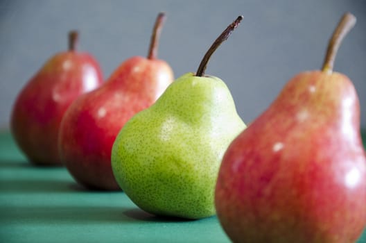 Red and green apples macro close-up with a focus on green Apple