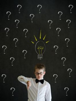 Thumbs down dressed up as business man questioning ideas on blackboard background