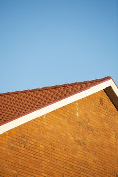 Brick wall building towards blue sky