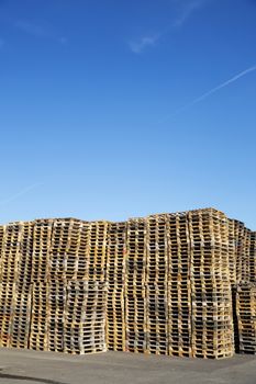 Large group of pallets towards blue sky