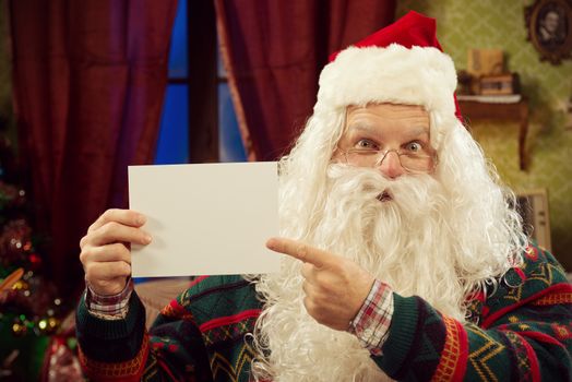 Happy Santa Claus with greeting cards, copy space

