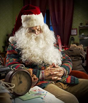 Portrait of Santa Claus sleeping on armchair