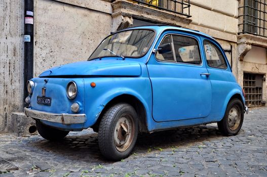 ROME - SEPTEMBER 20: A Fiat 500 on September 20, 2013 in Rome. Fiat 500 was produced by the Fiat company from 1957 to 75. Taken in Rome, Italy on September 20, 2013