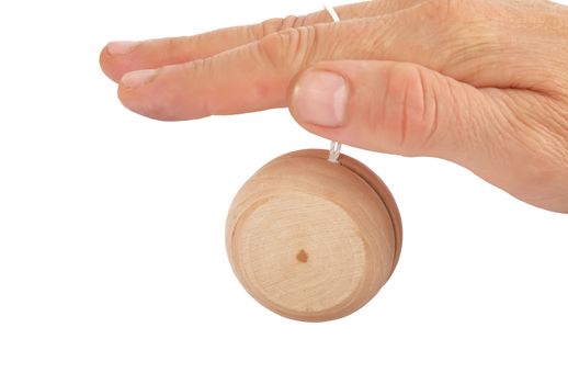 closeup of a hand playing yo-yo over white background