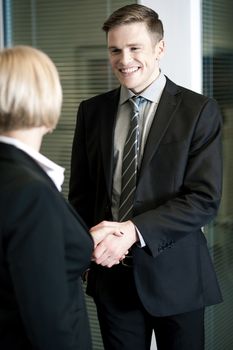 Two business people shaking hands