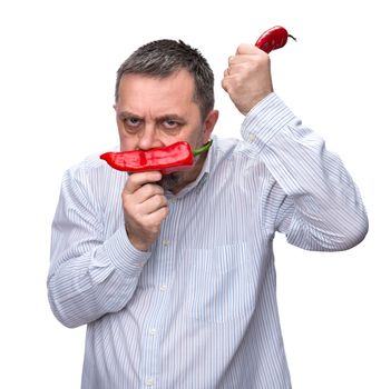 Organic food. Joy of vegetarianism. A man with a red pepper. Isolated on white