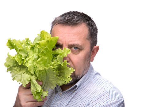 Organic food. Man holding lettuce isolated on white