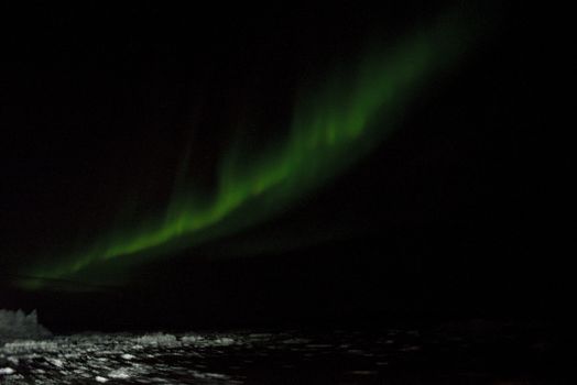 Northern lights over Disko Bay in Greenland