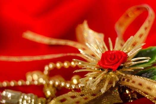 Red and gold. Holiday decorations on the background fabric