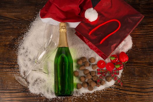 Bottle of champagne surrounded by a  Christmas still life