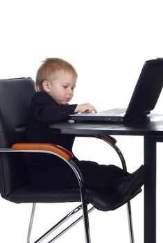 Little businessman working with computer