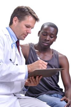 Young black male athlete looks over documents and lab results with his doctor on white background
