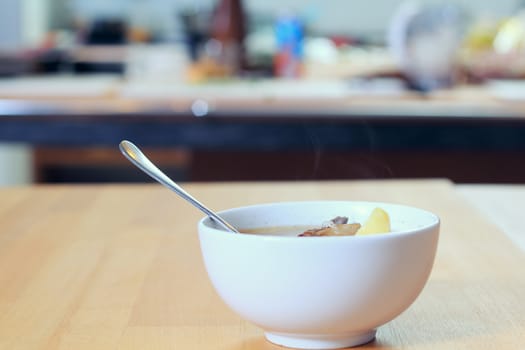 Dish with a soup on the table