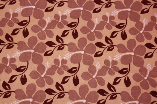 Pink flowers and brown leaves on textil background