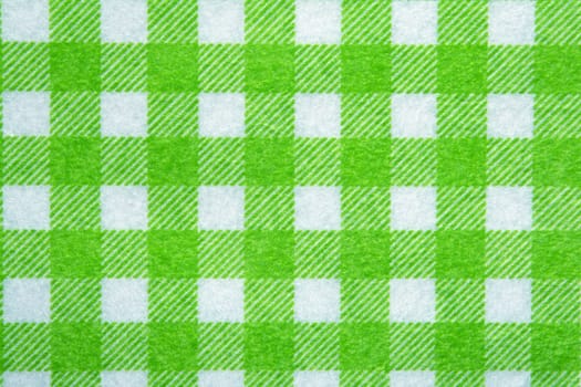 Material into green grid, textile background