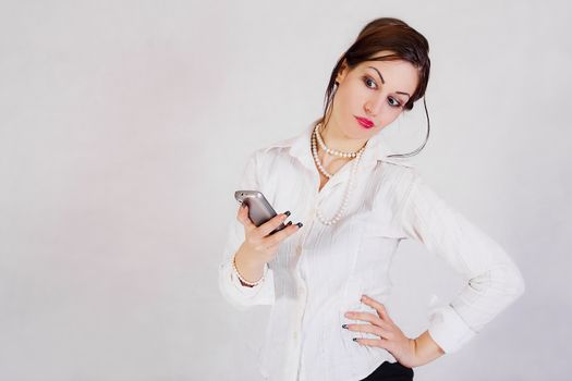 portrait of young business woman holding the cell phone