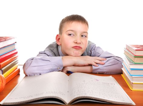 Bored Boy on the School Desk Isolated on the white background