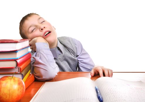 Tired Boy Sleeping on the School Desk on the white background